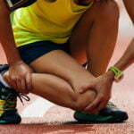 A person sitting due to sports injury
